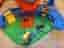 Hot Wheels lekset med bana och bilar  Monster Trucks T-Rex Volcano Arena
