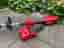 Milwaukee M18 BLLT grästrimmer med batteri och laddare röd