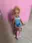 Barbie docka med trehjuling och vagn