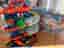 Hot Wheels Ultimate Garage bilbana med dinosaurus