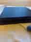 Sony Playstation 4 spelkonsol svart med blå handkontroll