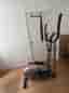 Cross trainer with a display and handles.