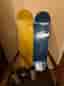 2 skateboard decks samt griptape och klistermärken.