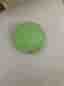 Grön squishy leksak med ansikte