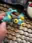 Bälte, pokemonboll och 2 figurer