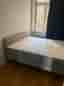 Selling an IKEA upholstered bed (160×200 cm) including mattress.
