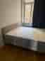 Selling an IKEA upholstered bed (160×200 cm) including mattress.
