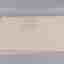 Duk med vävt mönster beige