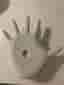 By Qubus Ljusstake i form av en hand