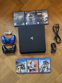 PlayStation 4 Pro 1TB med 2 handkontroller och 6 spel