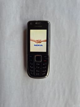 Nokia 3120 classic med laddare och manual.