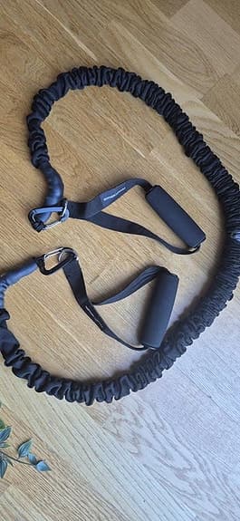 Träningsredskap elastiskt band med handtag