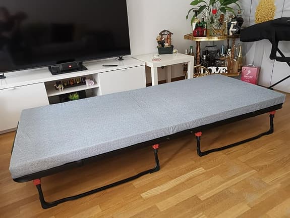 Folding bed with mattress