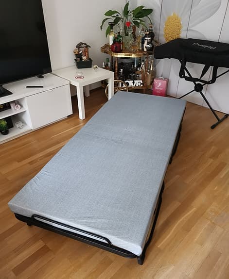 Folding bed with mattress