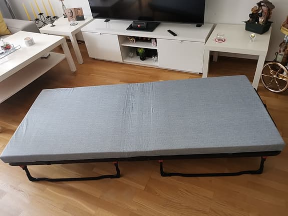 Folding bed with mattress