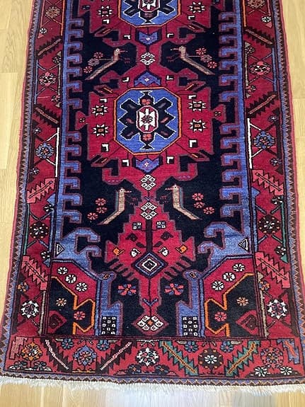 Orientalisk och äkta handknuten gångmatta