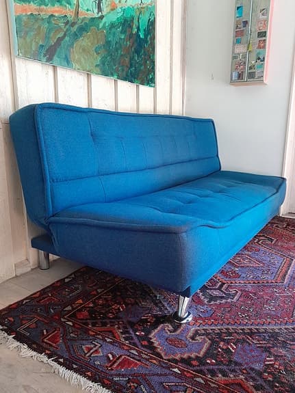 Blå bäddsoffa