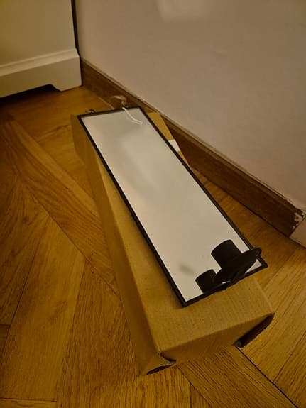 Spegel med ljushållare