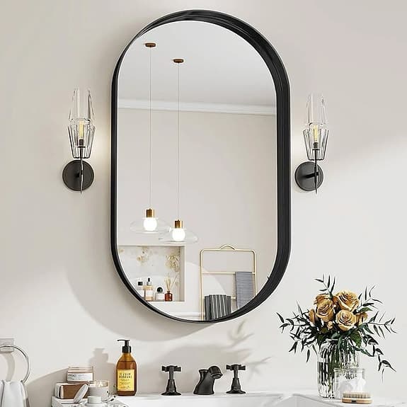 Väggspegel oval svart och guld