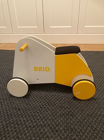 BRIO Barnleksak Gåcykel i trä gul och vit