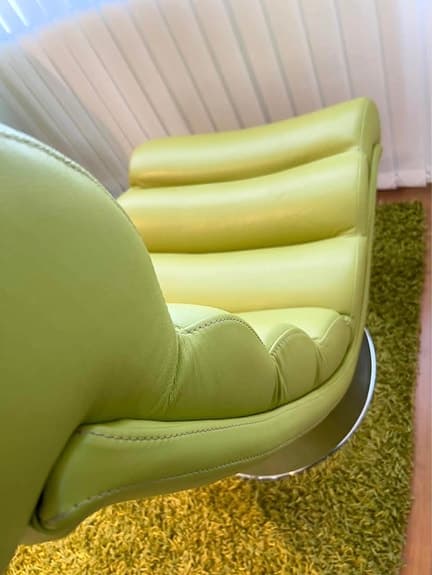 Two green leather armchairs + stool
