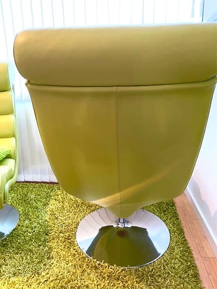 Two green leather armchairs + stool