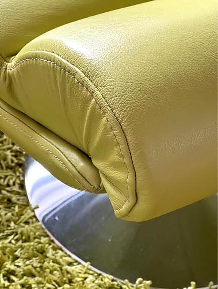 Two green leather armchairs + stool