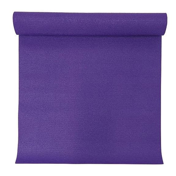 Pilatesboll och yogamatta i lila