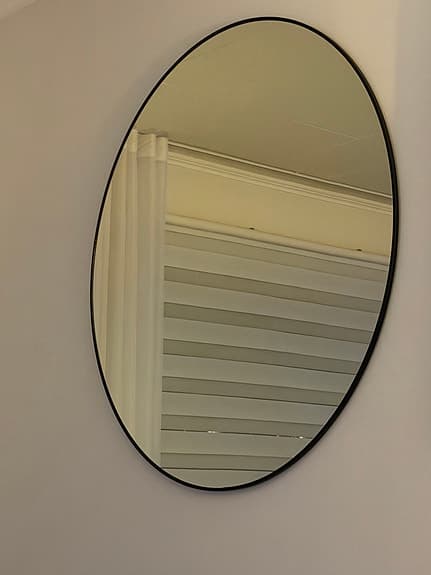 Rusta oval spegel med svart ram 85 cm