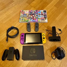 Nintendo Switch V2 + 2 par Joy-Cons + Joy-Con laddställ + 3 spel