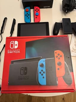 Nintendo Switch spelkonsol med Joy-Con neonröd och neonturkos