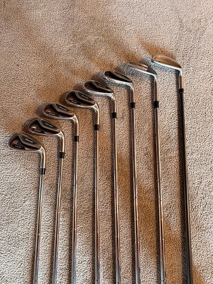 Golfklubbor järnset