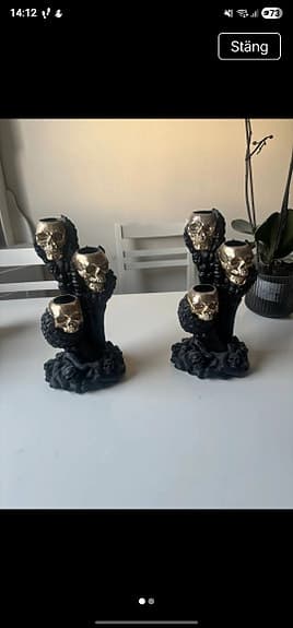 Ljusstakar med döskallemotiv svart guld