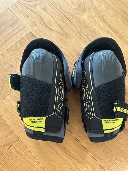 CCM JR Large ishockeyskydd armbågsskydd svart gul