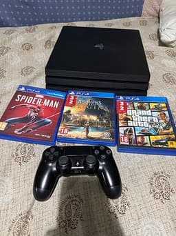 Sony Playstation 4 Pro spelkonsol svart med handkontroll och spel