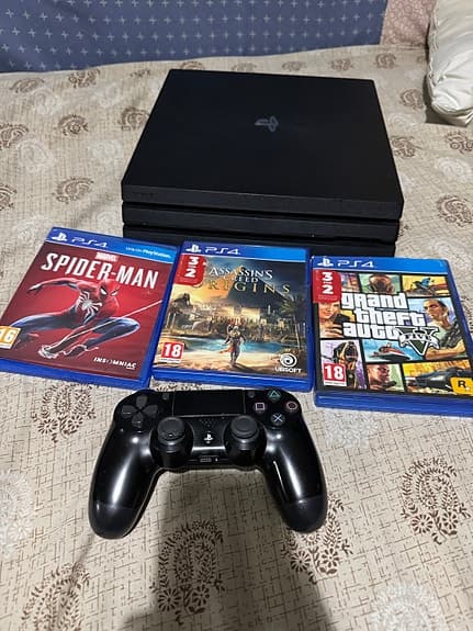 Sony Playstation 4 Pro spelkonsol svart med handkontroll och spel