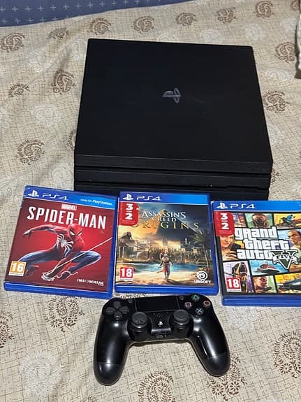 Sony Playstation 4 Pro spelkonsol svart med handkontroll och spel
