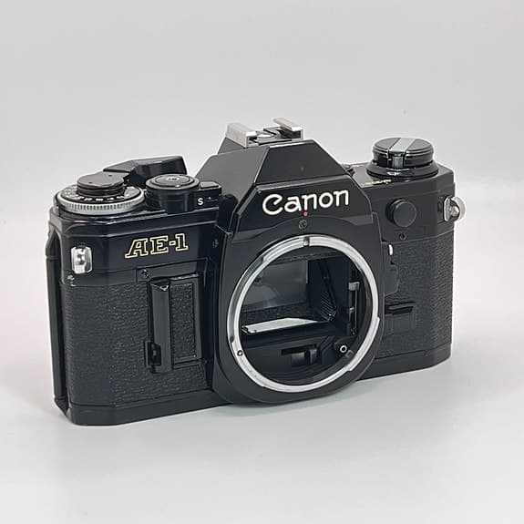 Svart Canon AE-1 kamerahus – Fullt fungerande