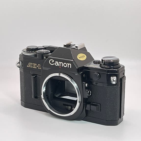 Svart Canon AE-1 kamerahus – Fullt fungerande