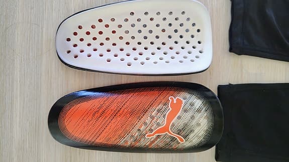 Puma benskydd fotboll orange svart för barn / junior