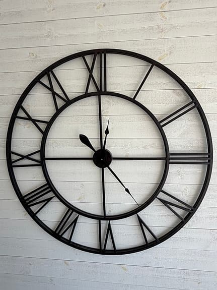 Mio Väggklocka metall svart med romerska siffror