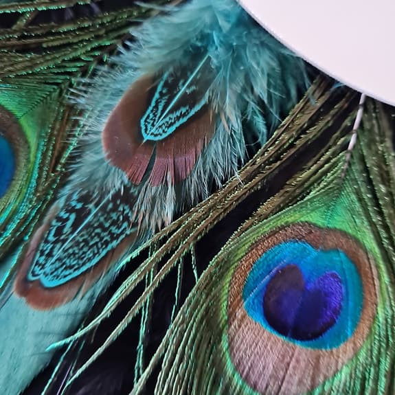 Fantastisk spegel med äkta Påfågelfjädrar. 45 cm. Handgjord!