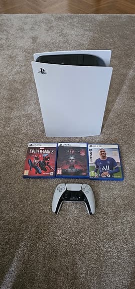 Sony Playstation 5 spelkonsol vit med handkontroll och spel