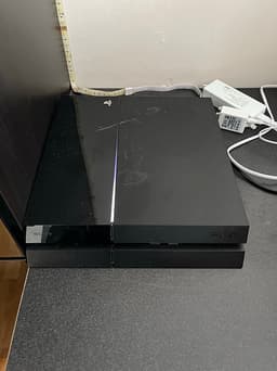 Sony Playstation 4 spelkonsol svart med handkontroll och spel