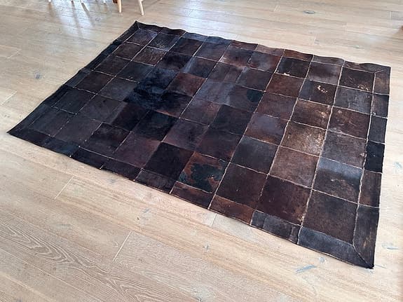 Äkta matta, svart koskinn ca 180x260