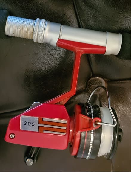 Kastspö (teleskop) med vintage spinnrulle