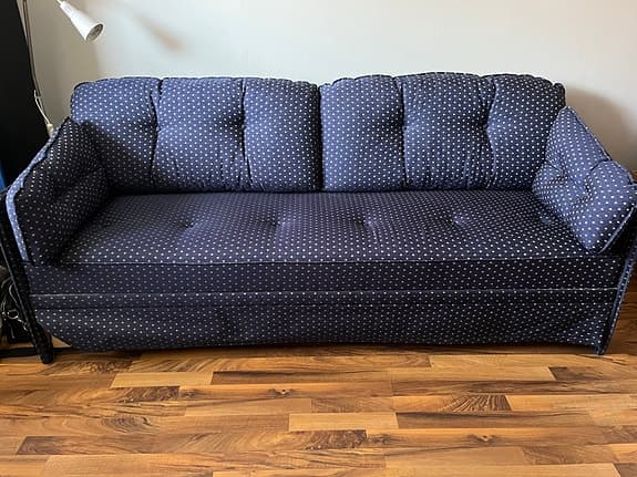 Bäddsoffa marinblå med små guldinslag