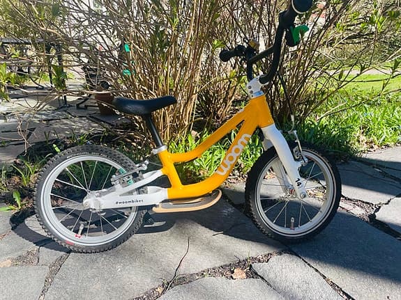 Woom 1 Plus barncykel 14" gul