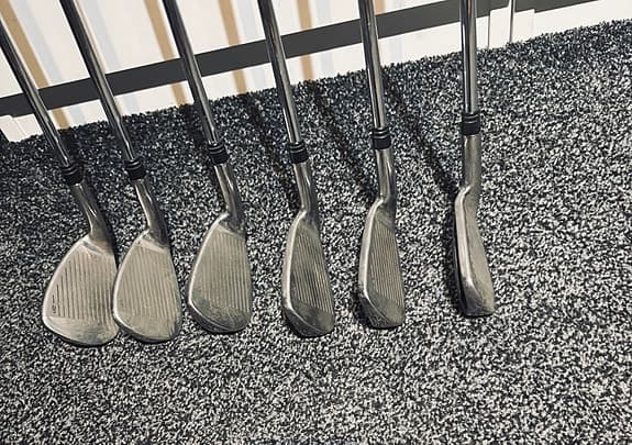 Golfklubbor järnset med stålskaft