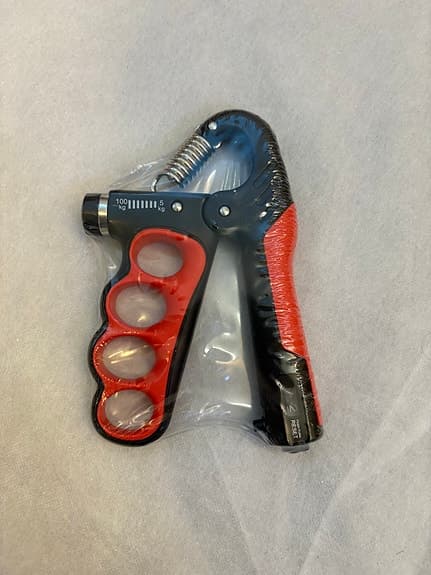 Handtränare justerbar 5–100 kg svart/röd